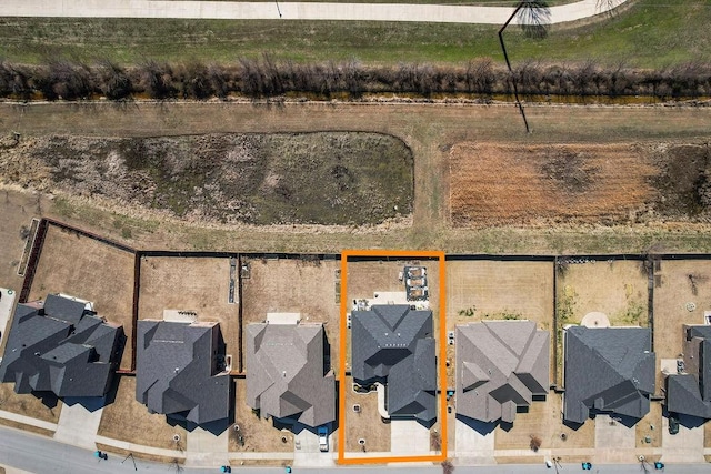 birds eye view of property with a residential view