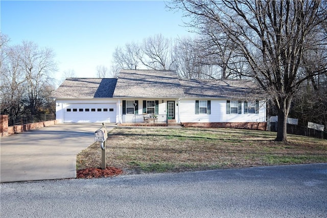 view of front of home with concrete driveway, a porch, fence, and a garage