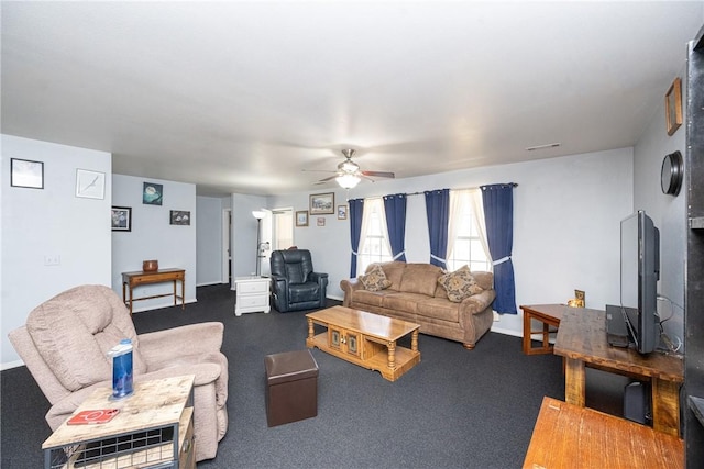 carpeted living area featuring visible vents, baseboards, and ceiling fan