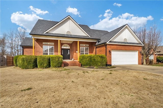 view of front facade with brick siding, an attached garage, a shingled roof, fence, and driveway