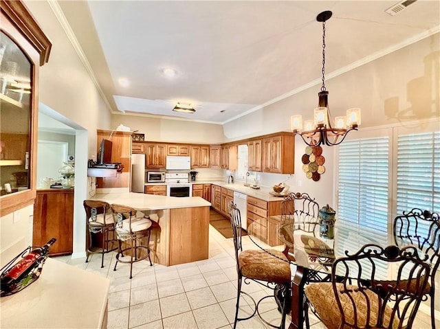 11 Saint Andrews Lane Holiday Island Unit 9, Holiday Island, AR 72631 - kitchen with white appliances, a peninsula, a chandelier, crown molding, and light countertops
