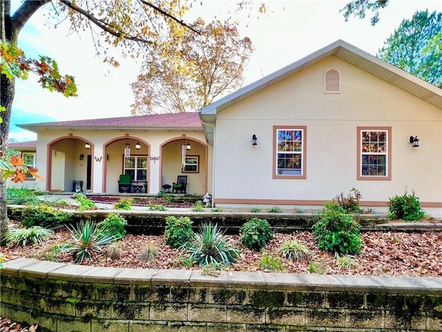 11 Saint Andrews Lane Holiday Island Unit 9, Holiday Island, AR 72631 - view of front of home with a porch and stucco siding