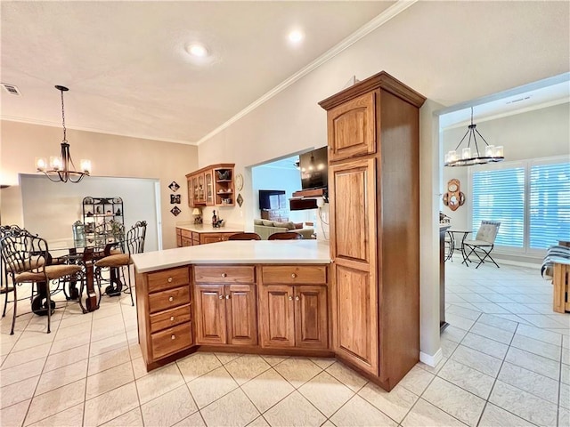 11 Saint Andrews Lane Holiday Island Unit 9, Holiday Island, AR 72631 - kitchen featuring a chandelier, light tile patterned floors, ornamental molding, light countertops, and brown cabinets