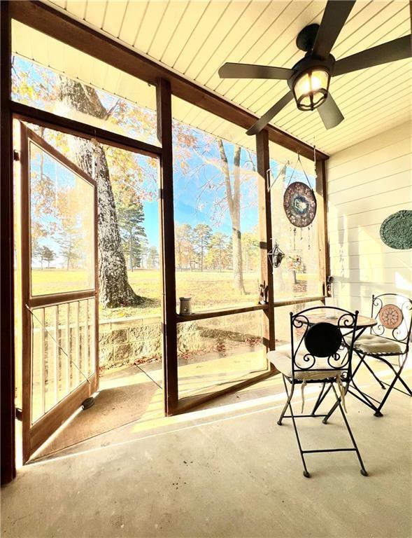 11 Saint Andrews Lane Holiday Island Unit 9, Holiday Island, AR 72631 - sunroom / solarium featuring a ceiling fan