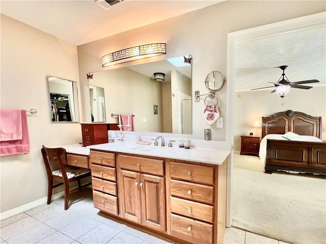 11 Saint Andrews Lane Holiday Island Unit 9, Holiday Island, AR 72631 - ensuite bathroom with vanity and ceiling fan