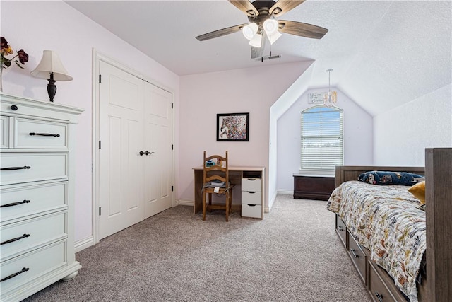 bedroom featuring visible vents, ceiling fan, carpet, vaulted ceiling, and a textured ceiling