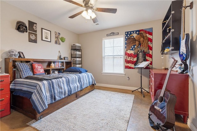 bedroom with a ceiling fan and baseboards