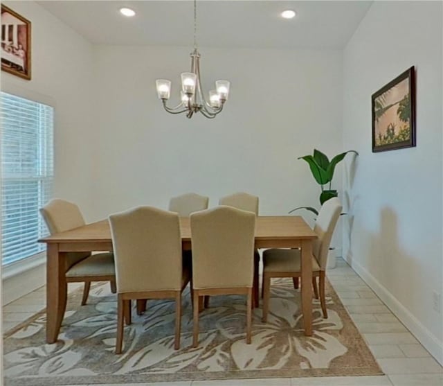 dining space with an inviting chandelier, recessed lighting, and baseboards