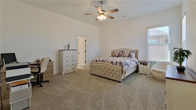 bedroom with a ceiling fan and carpet flooring