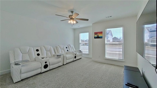 cinema featuring visible vents, baseboards, and ceiling fan