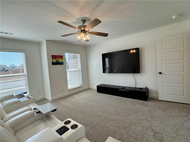 unfurnished living room featuring carpet flooring, a healthy amount of sunlight, and visible vents