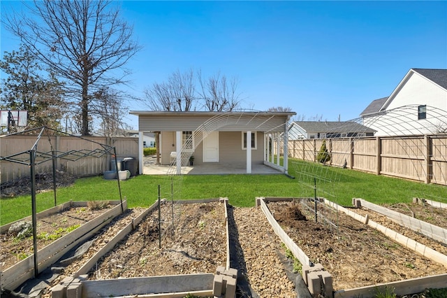 706 NW B St, Bentonville, AR 72712 - back of property featuring a fenced backyard, a garden, a patio area, and a yard