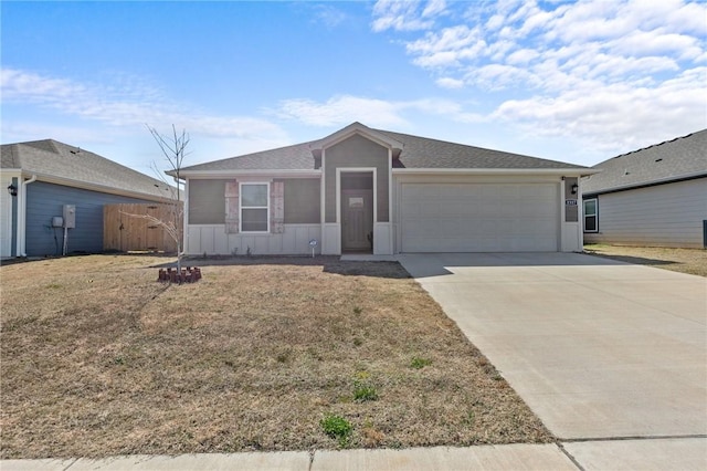 ranch-style home with a garage, board and batten siding, concrete driveway, and fence