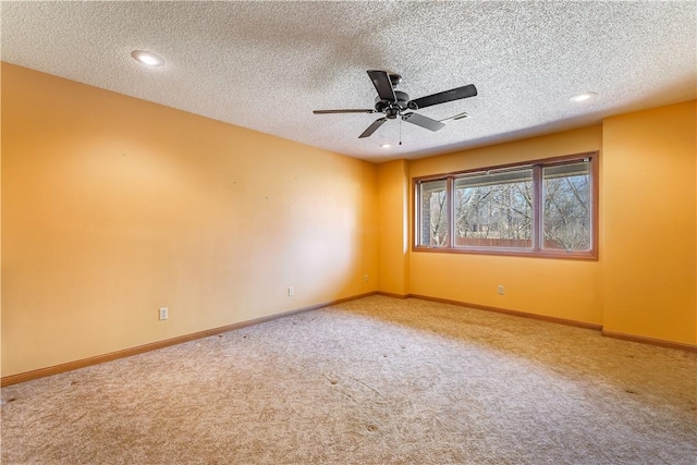 carpeted empty room with recessed lighting, visible vents, baseboards, and a textured ceiling