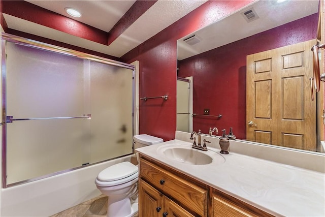 bathroom with visible vents, bath / shower combo with glass door, toilet, and vanity