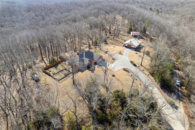 bird's eye view featuring a wooded view