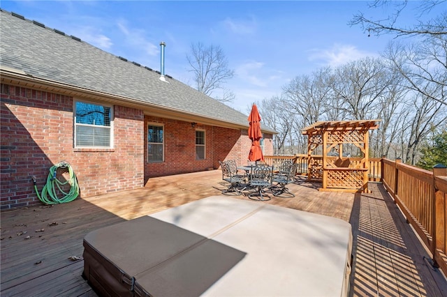 wooden terrace featuring a pergola and outdoor dining area