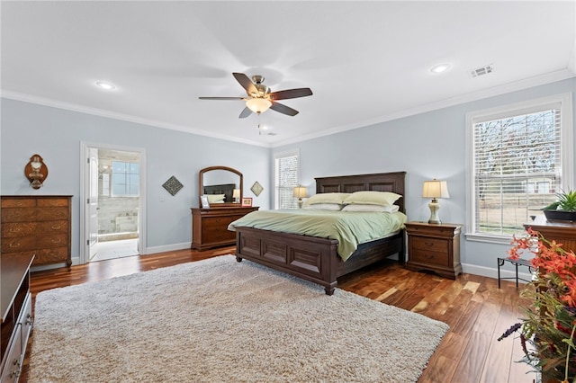 bedroom with multiple windows, crown molding, baseboards, and wood finished floors