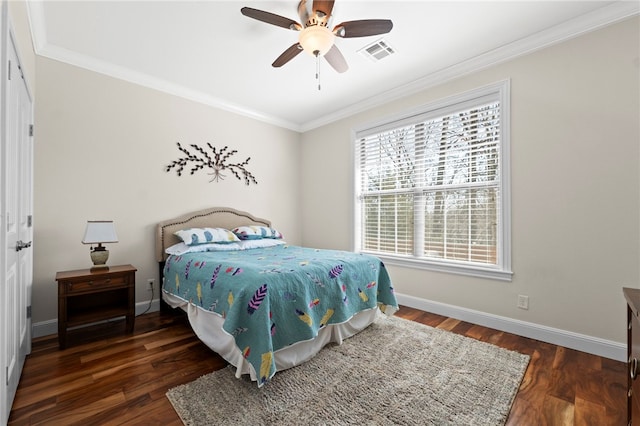 bedroom featuring crown molding, wood finished floors, and visible vents