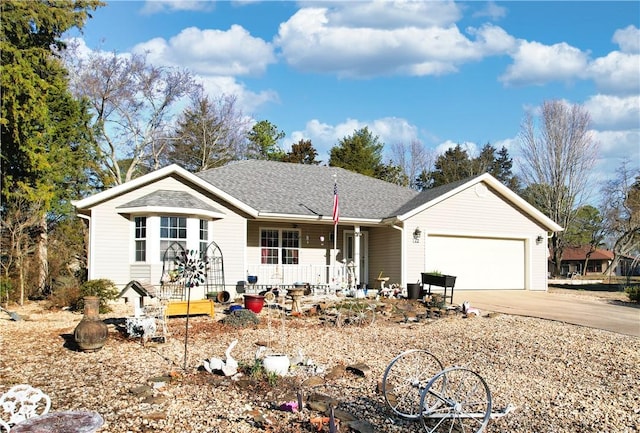 ranch-style home with a garage, covered porch, driveway, and a shingled roof