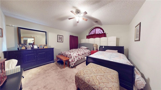 bedroom with ceiling fan, vaulted ceiling, carpet flooring, and a textured ceiling