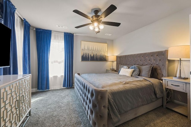 bedroom featuring visible vents, a ceiling fan, and carpet floors