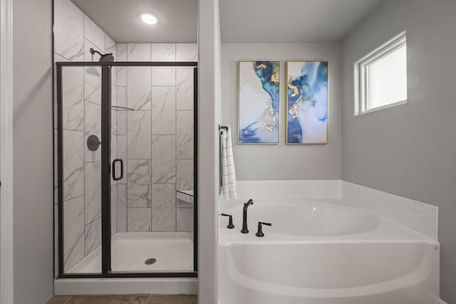 full bathroom with a garden tub and a stall shower