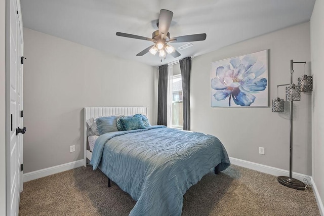 carpeted bedroom with visible vents, baseboards, and ceiling fan