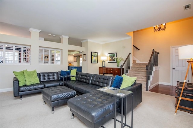 living area featuring stairs, crown molding, baseboards, and visible vents