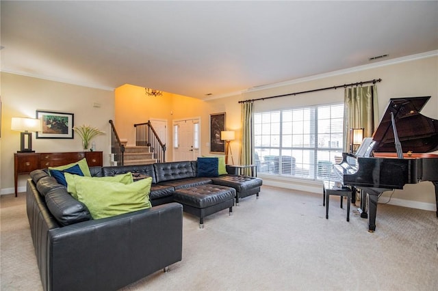 living area featuring visible vents, baseboards, stairway, ornamental molding, and light carpet