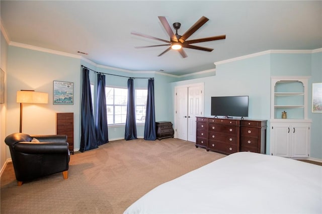 bedroom featuring visible vents, baseboards, carpet flooring, and crown molding