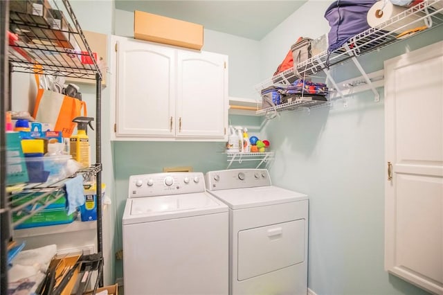 laundry area featuring cabinet space and separate washer and dryer