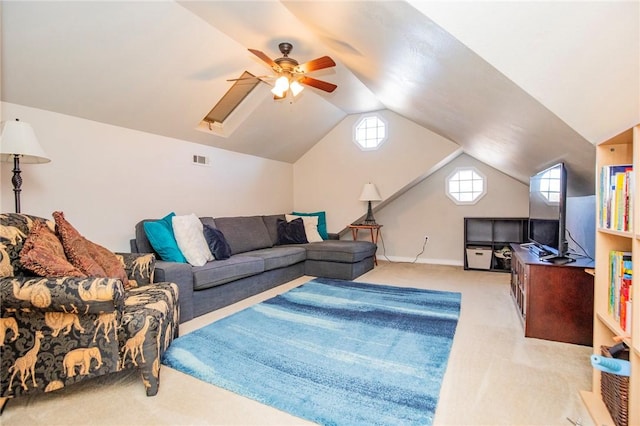 carpeted living room featuring visible vents, baseboards, a ceiling fan, and vaulted ceiling