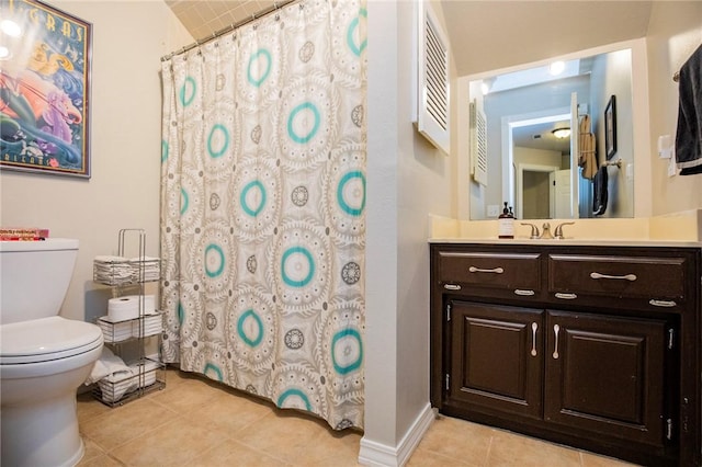 bathroom featuring vanity, a shower with curtain, baseboards, tile patterned floors, and toilet