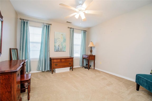 sitting room featuring visible vents, carpet flooring, baseboards, and ceiling fan