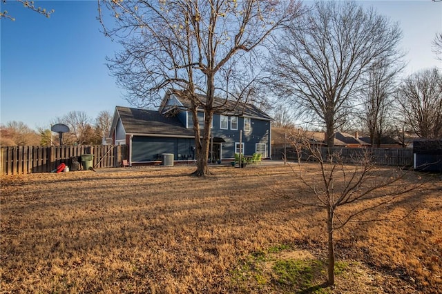 back of property with cooling unit and fence