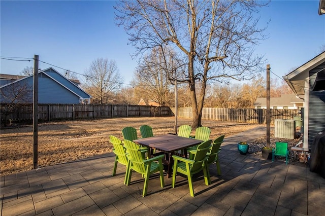 view of patio with outdoor dining area and a fenced backyard