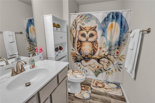 full bathroom featuring toilet, vanity, a shower with curtain, and wood finished floors