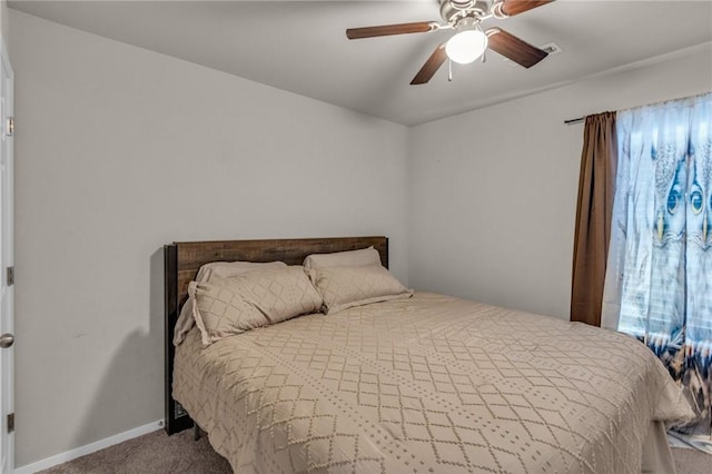 bedroom with baseboards, carpet floors, and ceiling fan