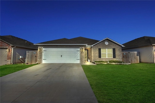 ranch-style home with a front lawn, fence, concrete driveway, an attached garage, and brick siding