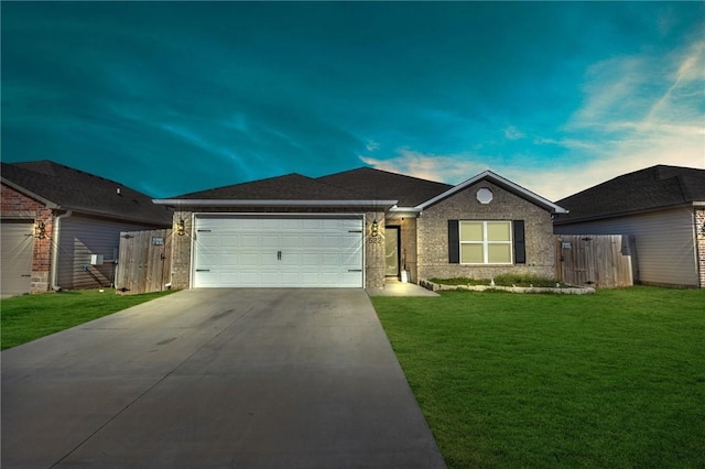 ranch-style home with a front yard, fence, driveway, an attached garage, and brick siding