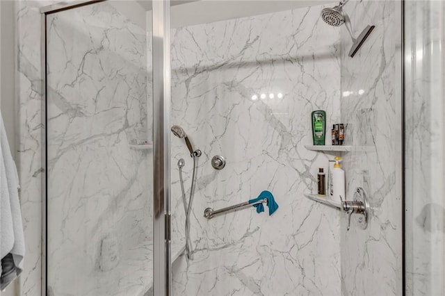 full bath featuring a marble finish shower