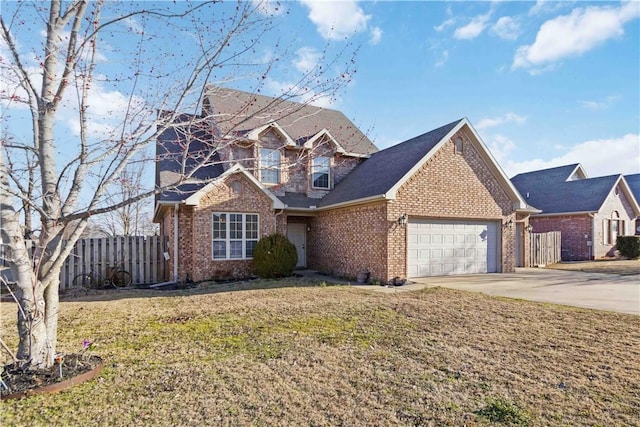 traditional home with brick siding, a front lawn, fence, a garage, and driveway