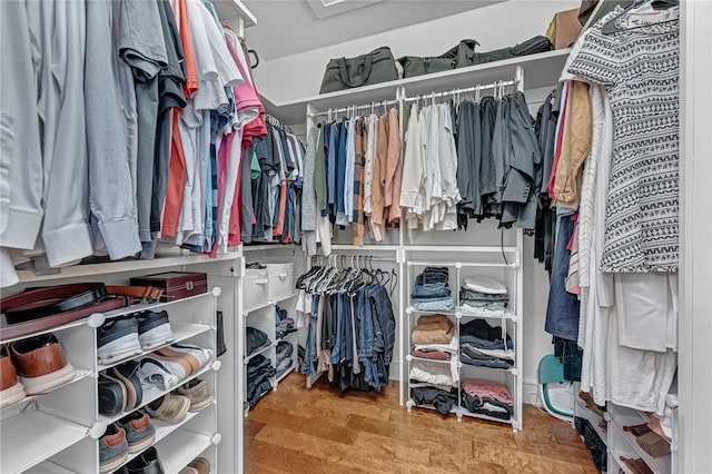 spacious closet featuring wood finished floors