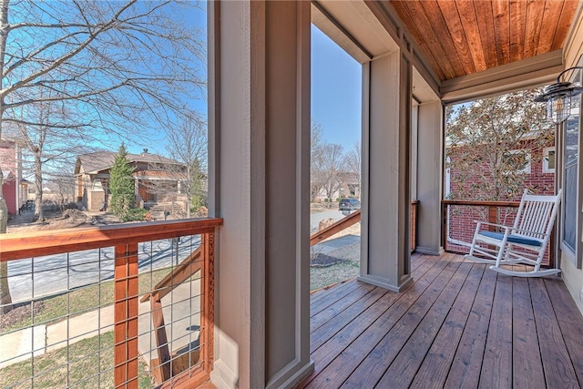 unfurnished sunroom with wood ceiling