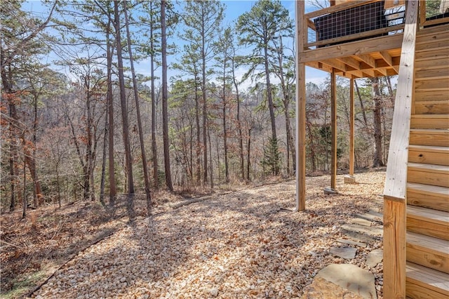 view of yard with a wooded view