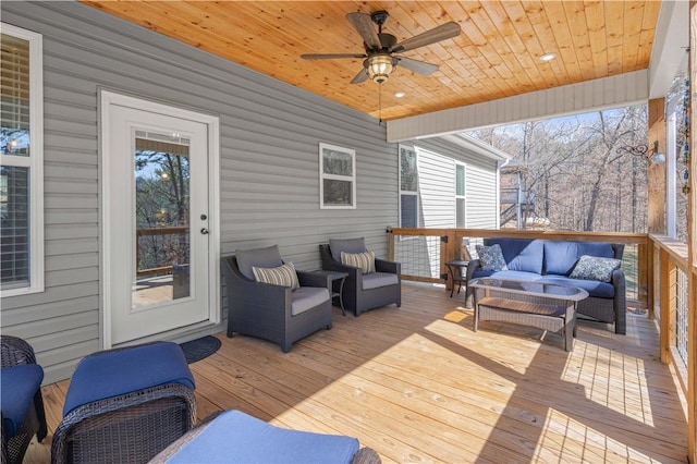 deck featuring an outdoor hangout area and ceiling fan