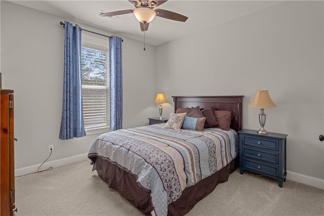 bedroom featuring a ceiling fan, baseboards, and light carpet