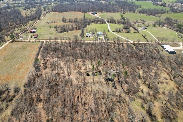 birds eye view of property with a rural view