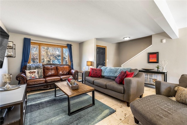 living room with light tile patterned floors and stairway